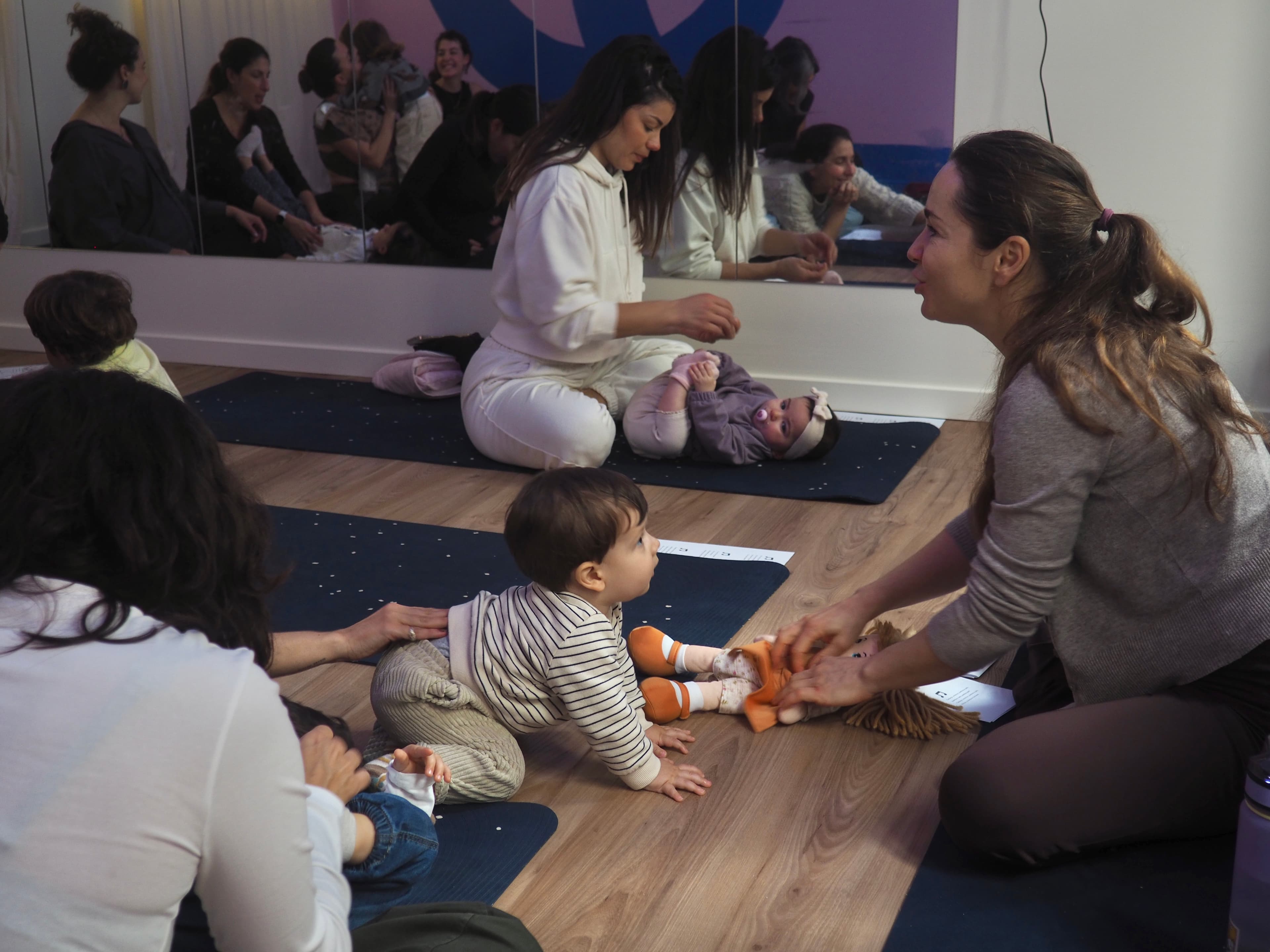 Parents and young children participating in a Baby & Me ritual at Circle